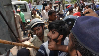 Police in Patna try to control student protesters demanding re-evaluation of answer books following high failure rates in the Bihar Board examination. 